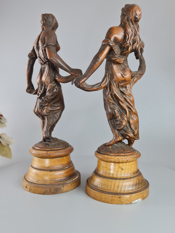 Pair Of Neoclassical Style Spelter Figures Of 'modesty' And 'gaiety' On Wooden Plinths C1900